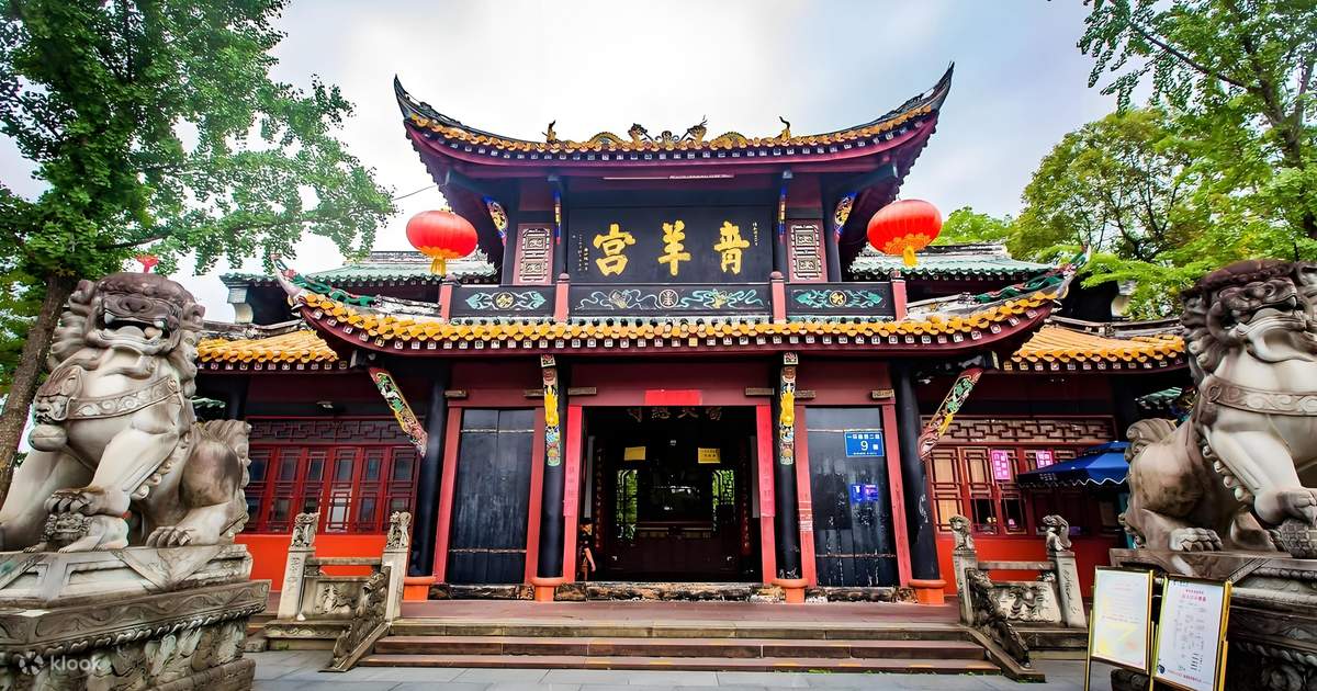 An ornate traditional Chinese building with red walls, black