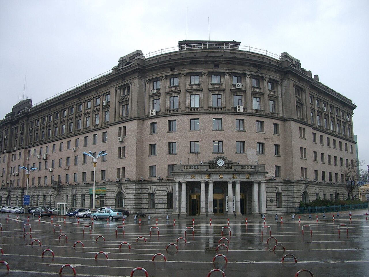 A large, historic, multi-story building with a classical facade, situated in an 