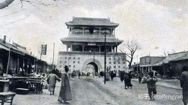 A historic black-and-white photograph depicts the four gates of Suiyuan city, wi