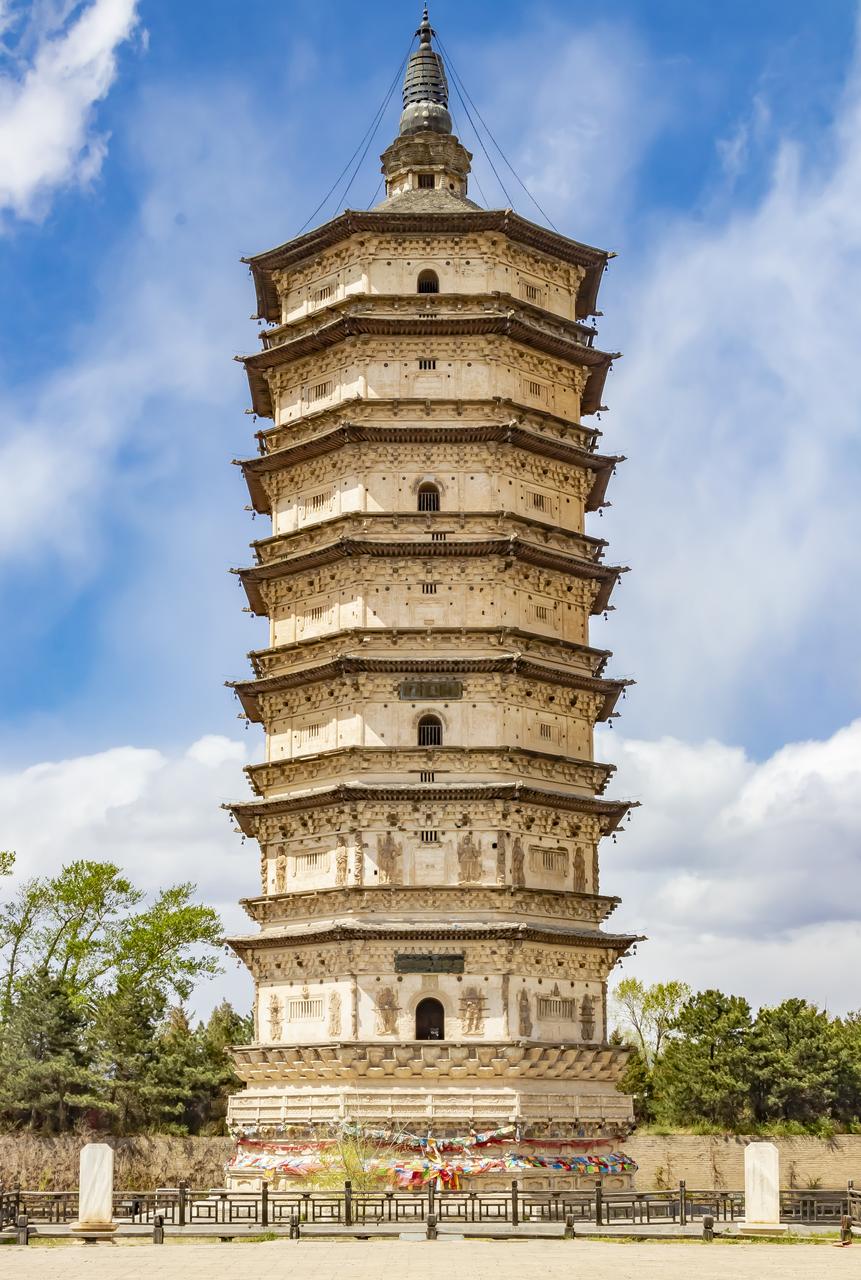 A multi-tiered pagoda with intricate architectural details stands prominently ag