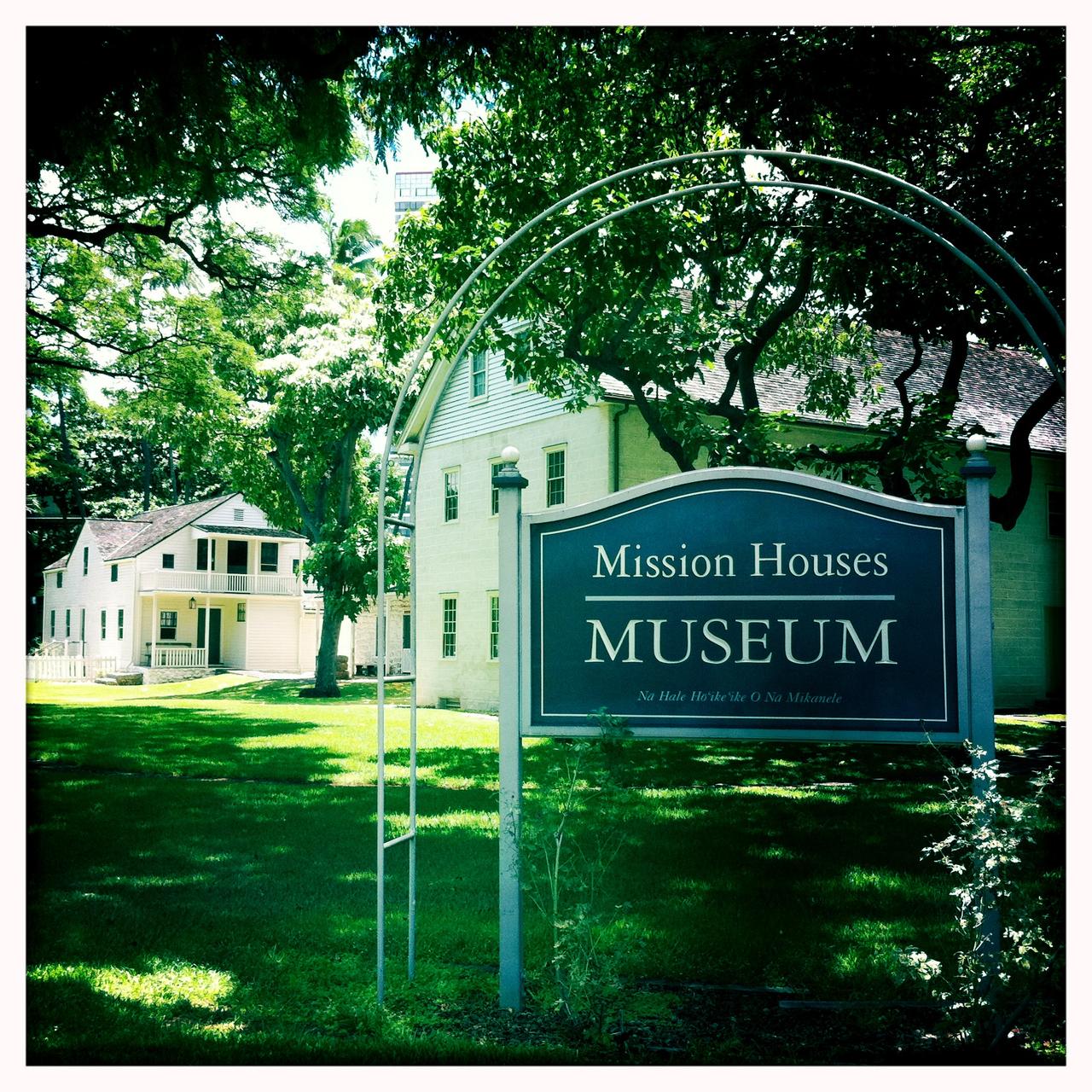 Mission Houses Museum frontage from King Street, showing the low wooden compound buildings