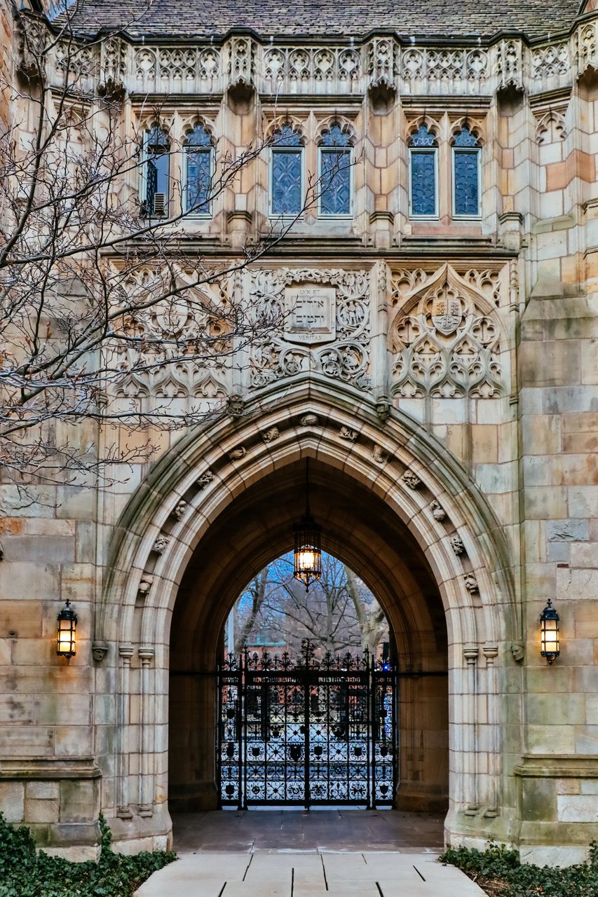 Memorial Quadrangle Gate on High Street showing the wrought iron gate with military emblems