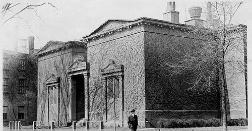 Exterior of Skull and Bones Tomb from High Street, showing the windowless brownstone facade and Egypto-Doric portico