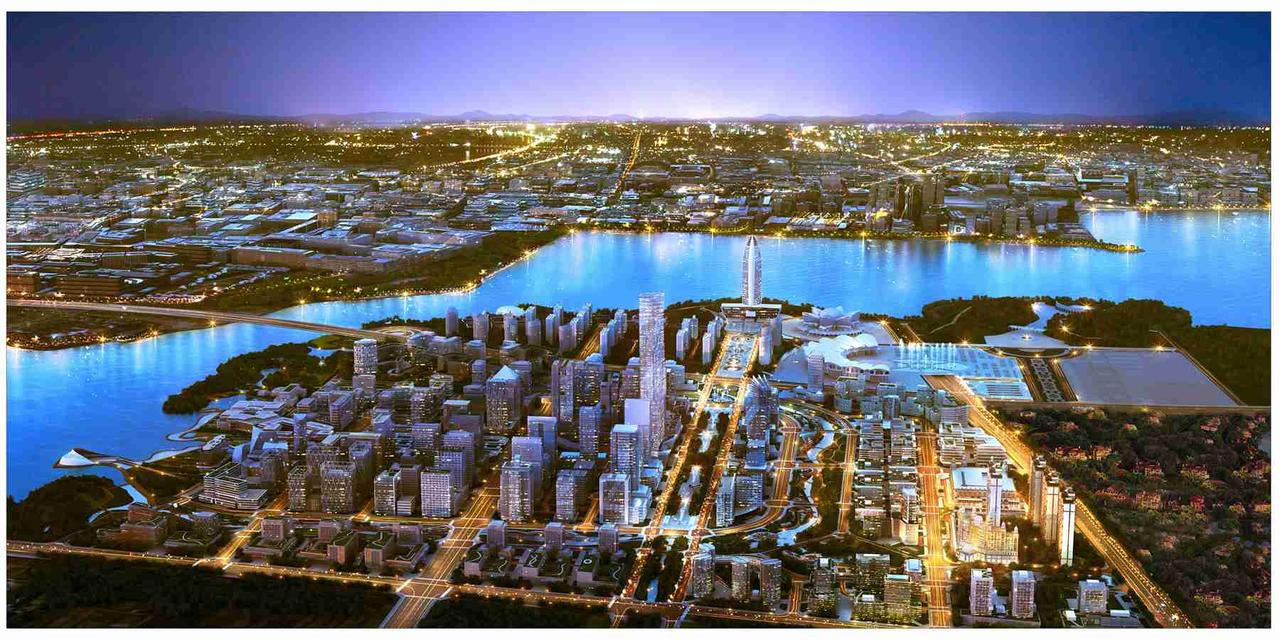 A nighttime aerial view of the central business district in 银川阅海湾 with illuminat