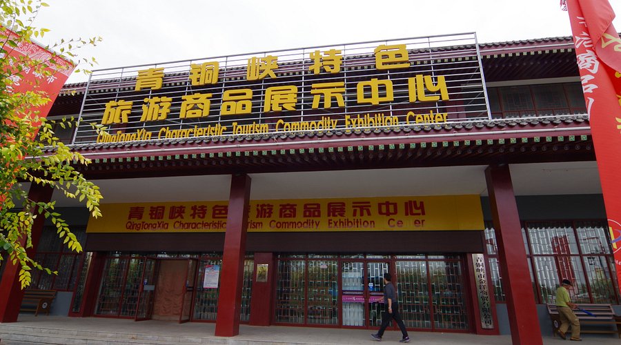 A traditional Chinese-style building with red columns and decorative elements, d